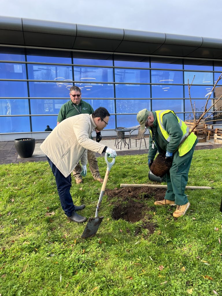 Bing Tian Planting the 1st Tree at Discovery Park